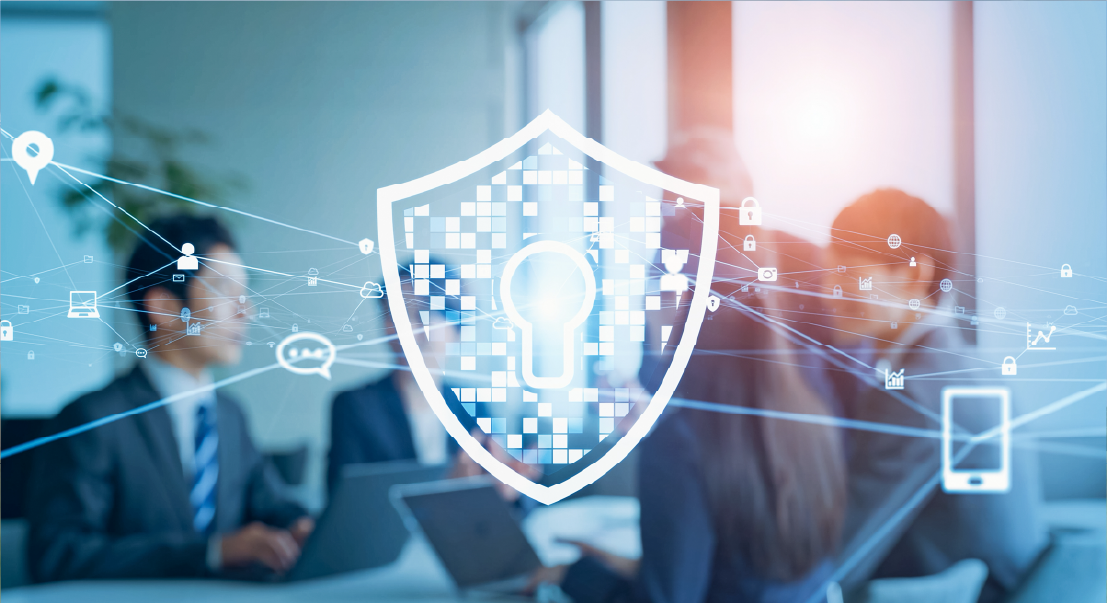Shield with a glowing lock over a modern office scene, symbolizing cybersecurity and data protection.